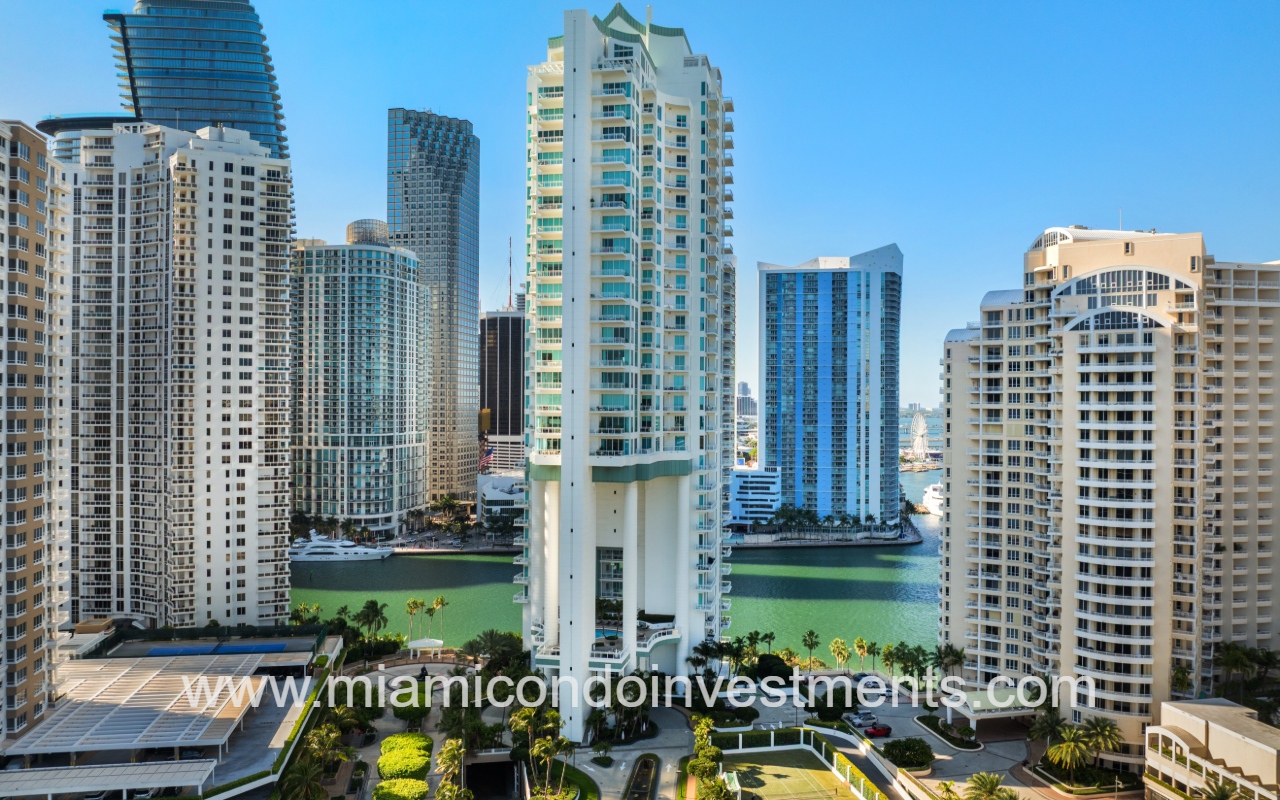 Asia condo front of building with waterfront backdrop