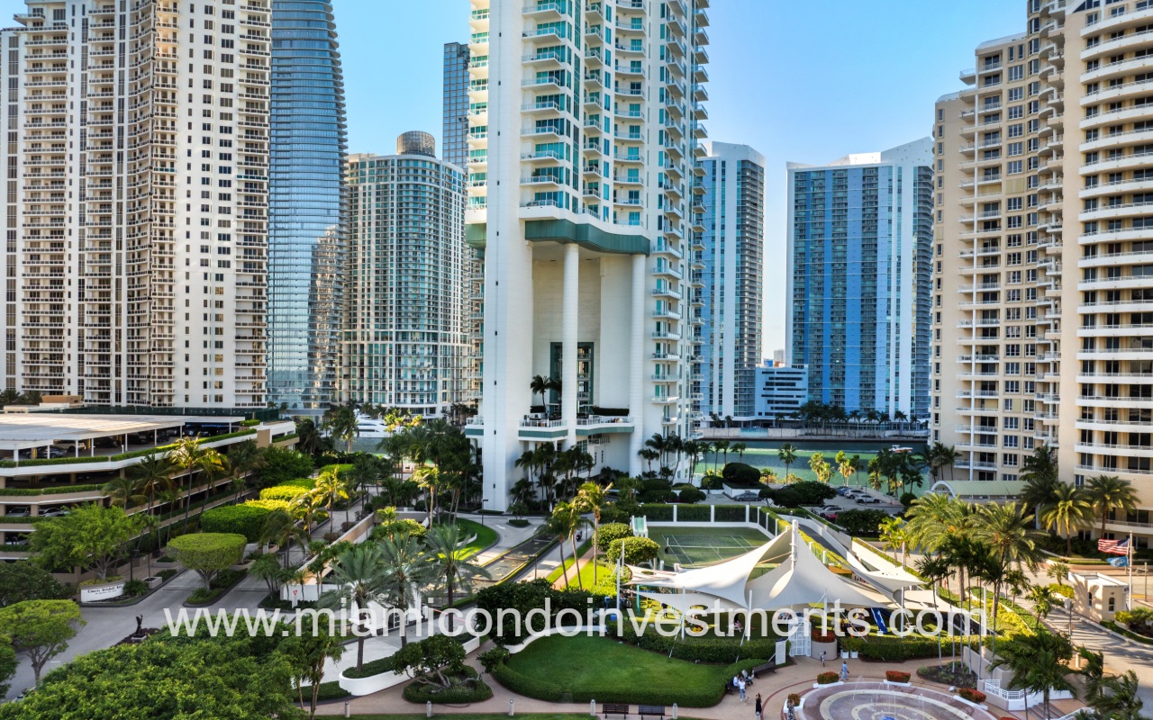 Asia condo drone facing front lower half of building and entry