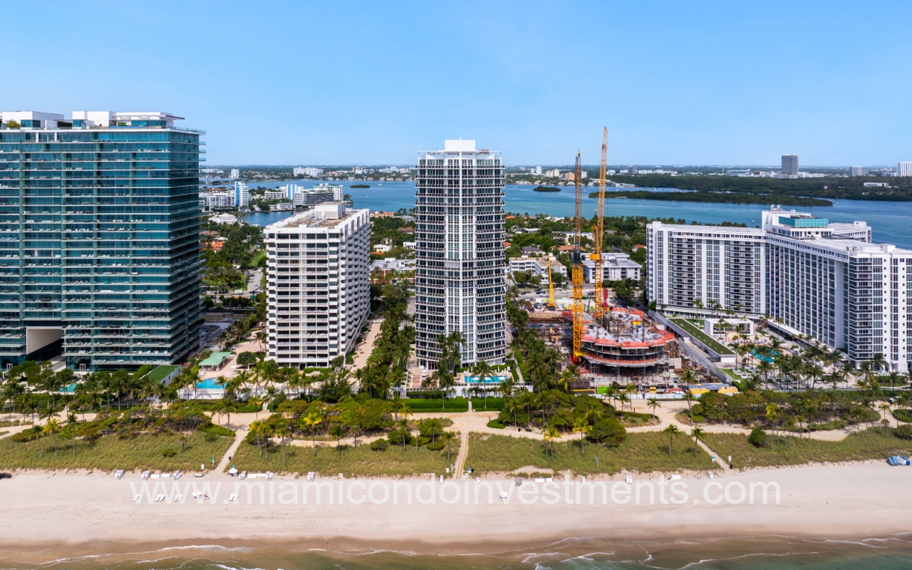 Bellini Bal Harbour drone view facing condo building from above the beach shore in the morning