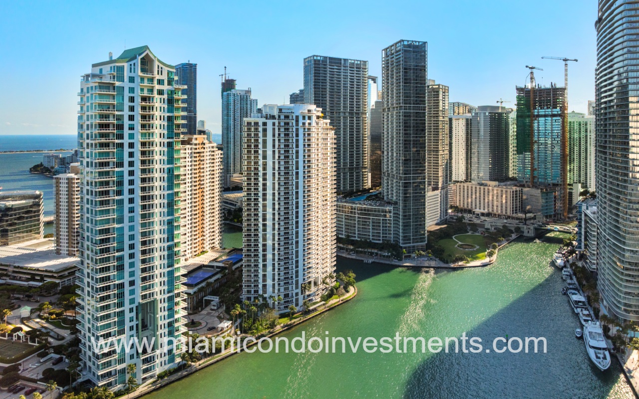 Carbonell drone of building from across waterway far shot