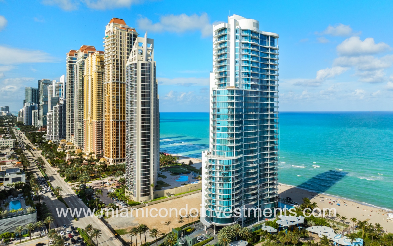 Chateau Beach Residences drone facing front side angle of condominium building in Sunny Isles Beach