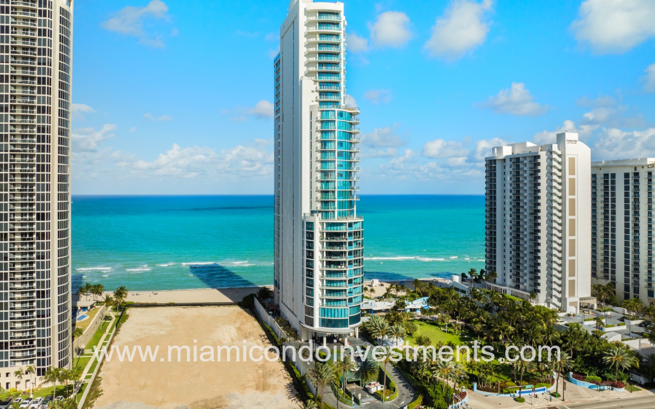 Chateau Beach Residences drone of condo building with blue ocean backdrop