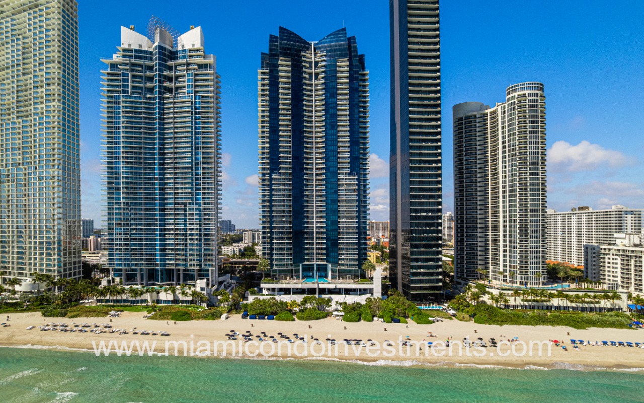 Jade Ocean drone facing building and beach