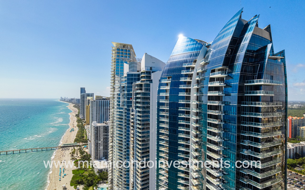 Jade Ocean condos drone of upper side building profile and ocean shoreline