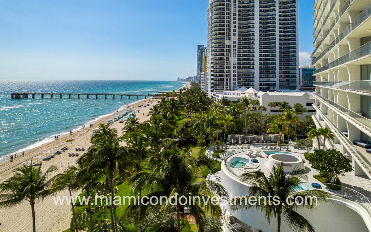 Jade Signature condo building side view of beach from building