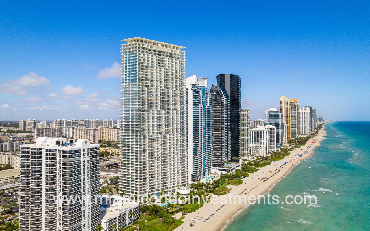 Jade Signature condos drone angle of building and beach