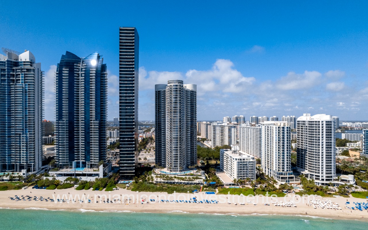 Ocean Four drone of condo building and along skyline