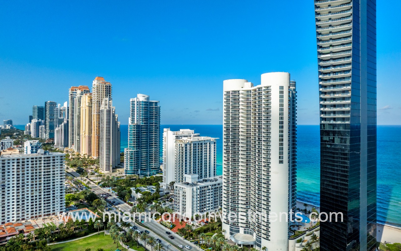 Ocean Four drone facing front angle of building and surrounding area