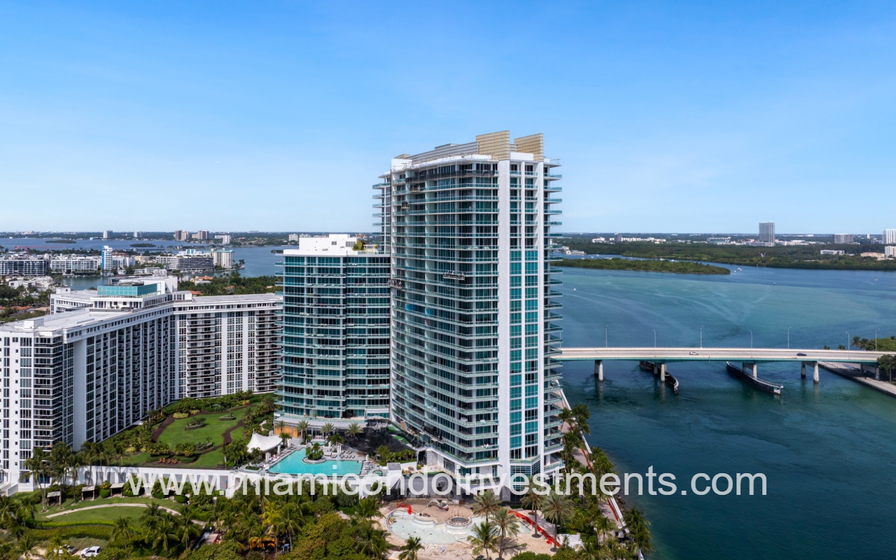 One Bal Harbour drone view facing condo building profile with waterfront surrounding