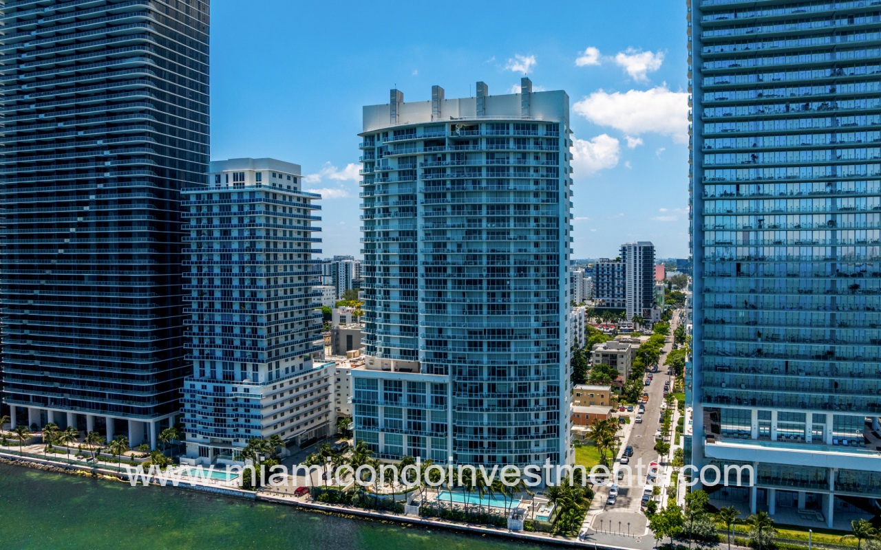 Onyx on the Bay drone facing the condo building from above the bay
