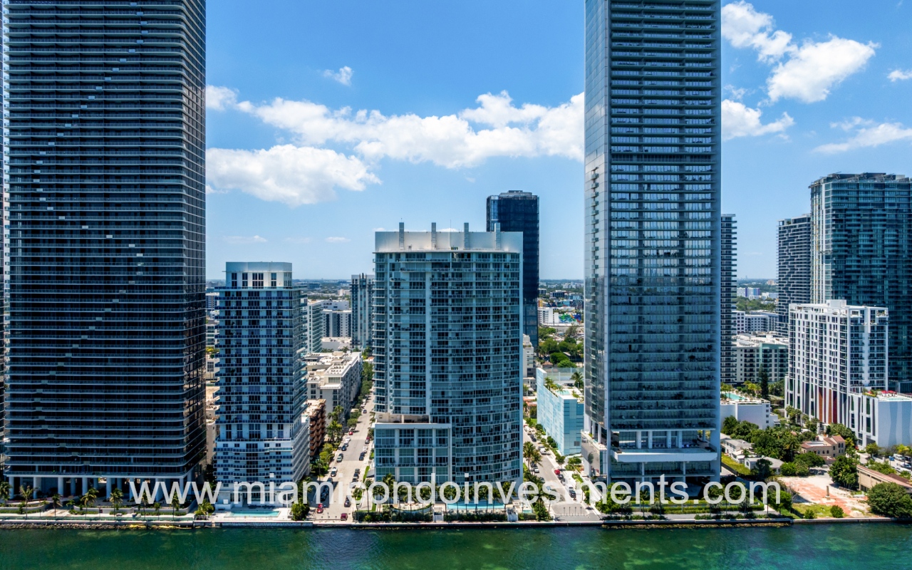 Onyx on the Bay drone directly facing the back of condo building from over the bay
