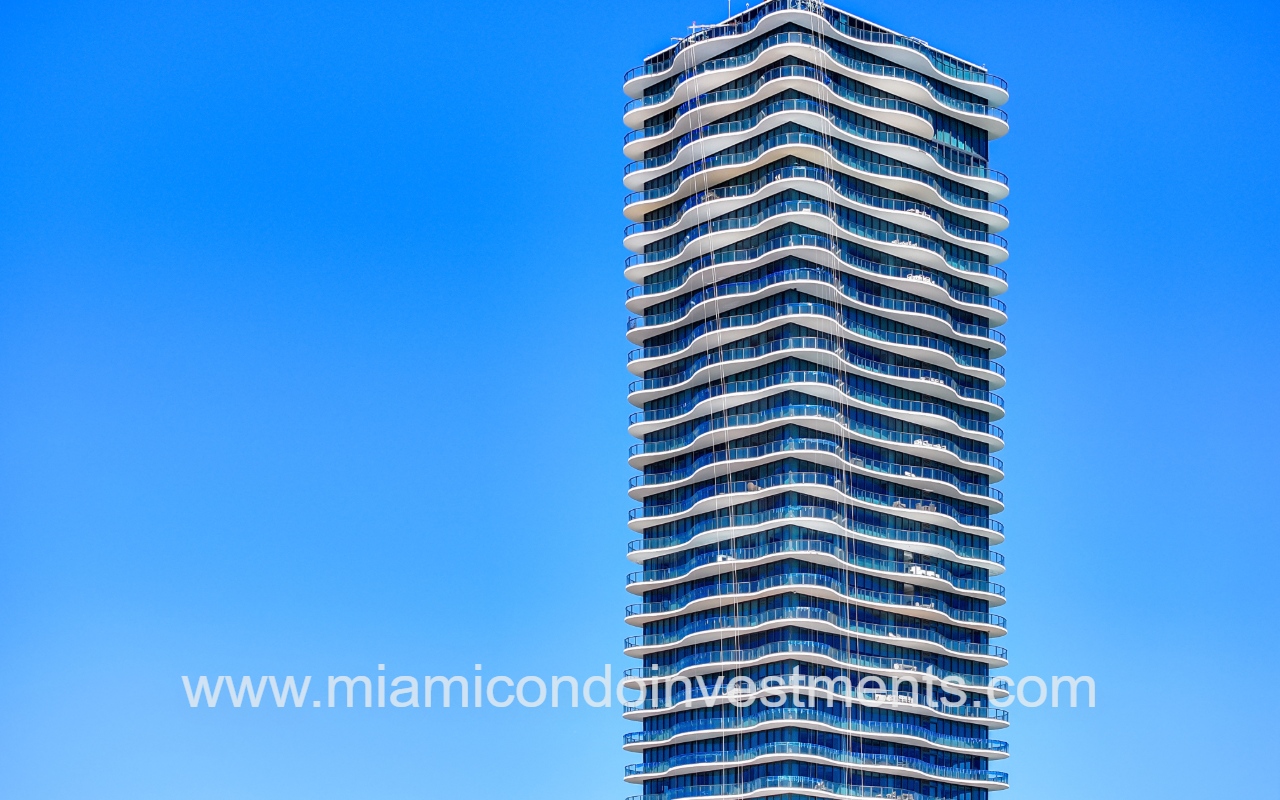 Regalia drone closeup facing top half of condo building exterior