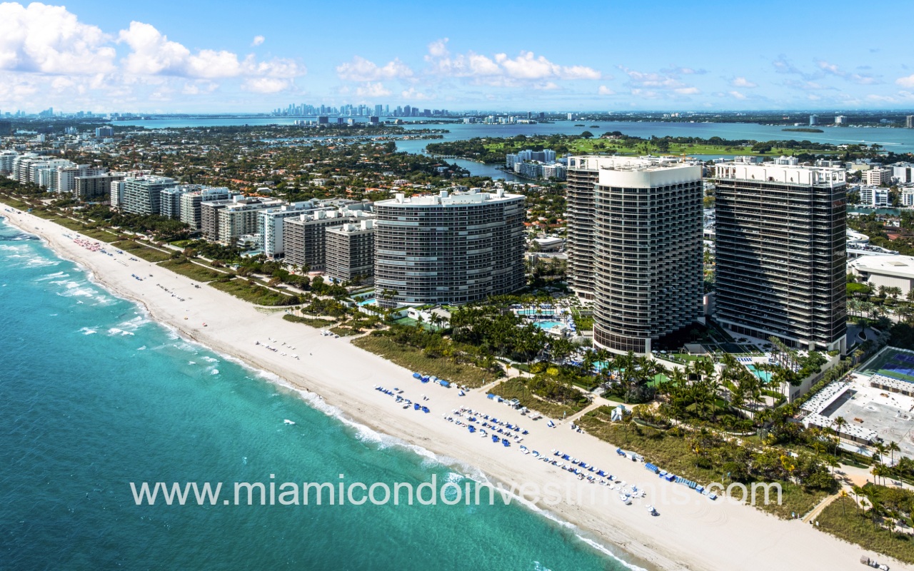 St. Regis Bal Harbour drone view of condo building along waterfront and surrounding area in the morning