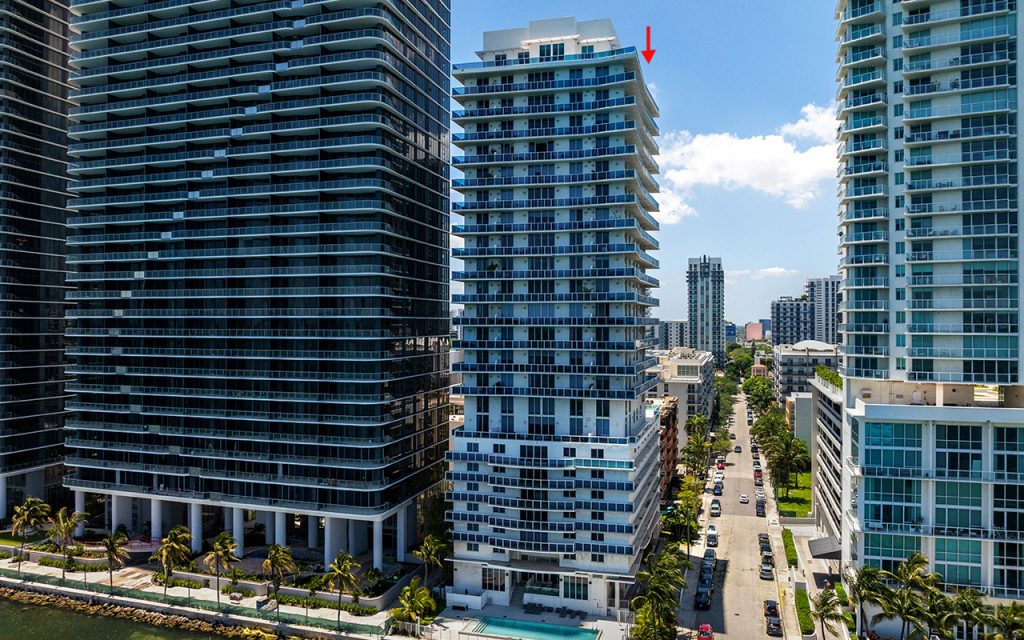 Star Lofts drone facing condo building and street from above the waterway