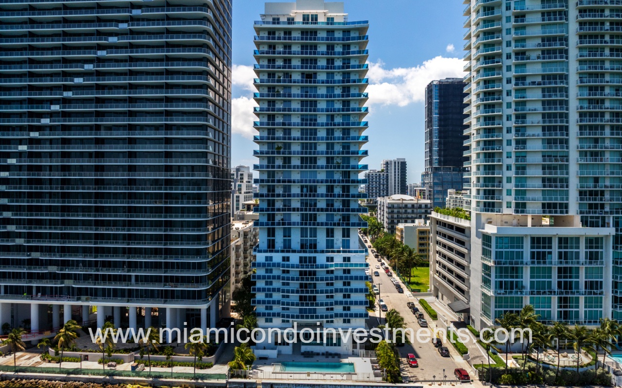 Star Lofts drone directly facing condo building and street from above the waterway