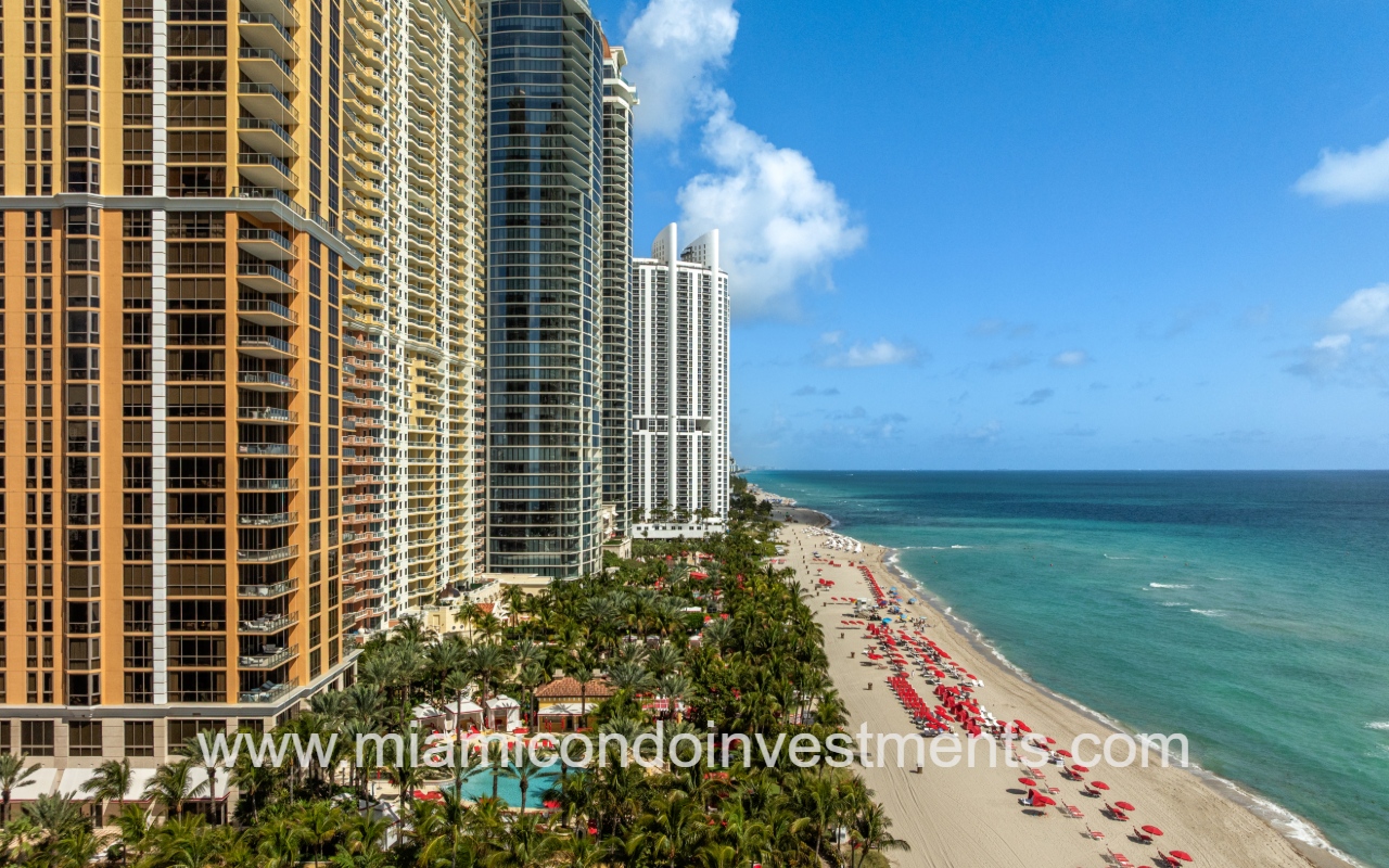 The Mansions at Acqualina drone profile view of condo building on beach