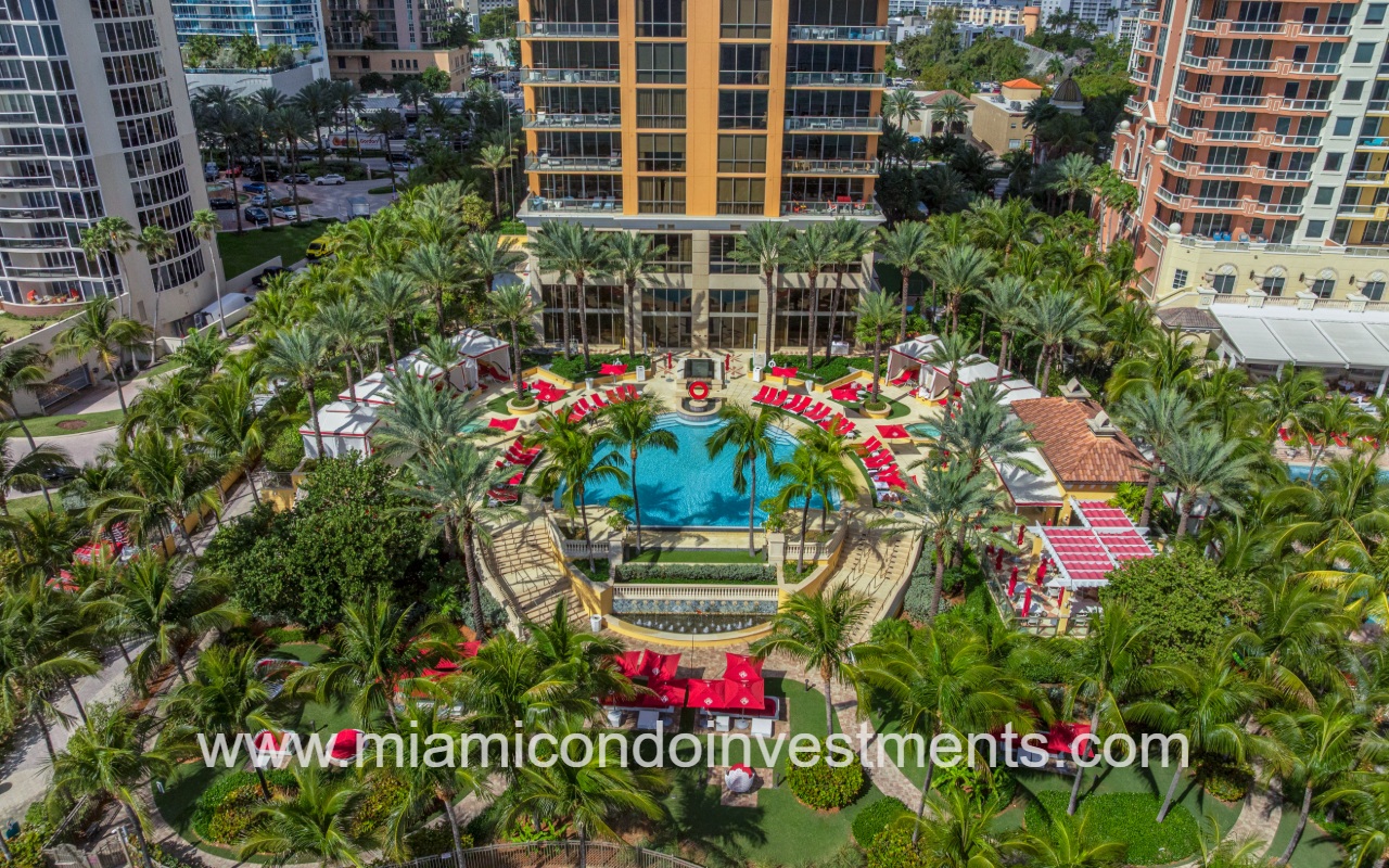 The Mansions at Acqualina drone overlooking lower building exterior and pool