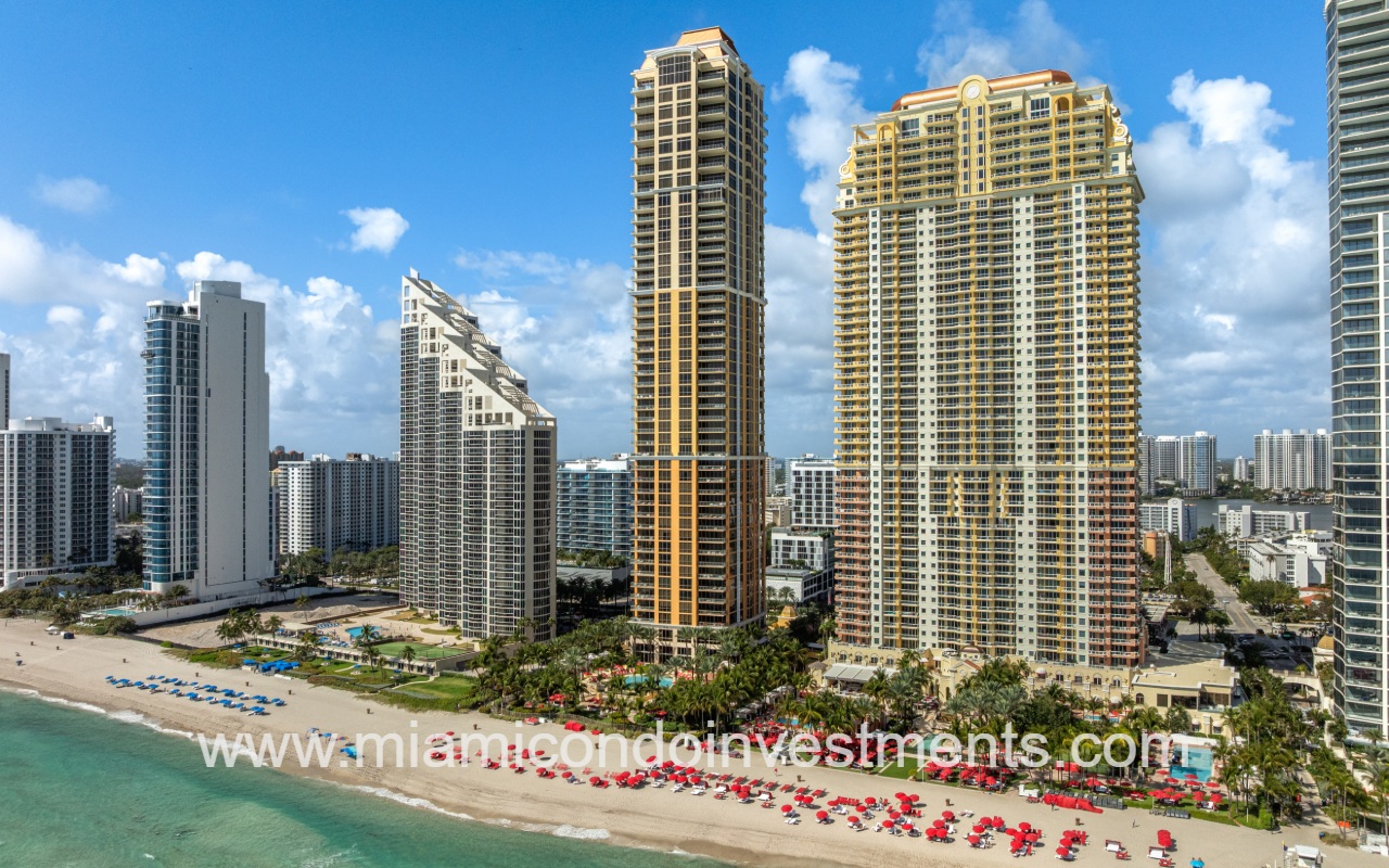 The Mansions at Acqualina drone facing condo building from over the ocean