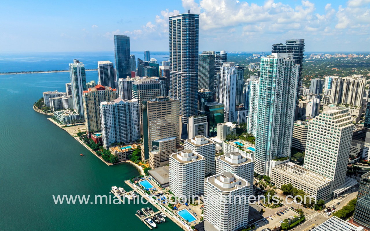 The Plaza Brickell East drone view of condo building and city from over the bay