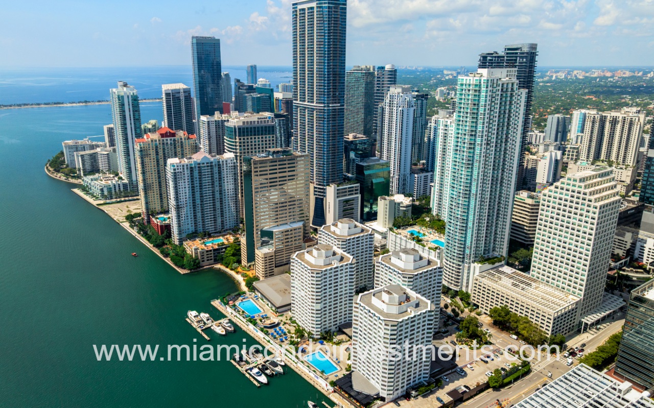 The Plaza Brickell East drone view of condo building and city from above the bay