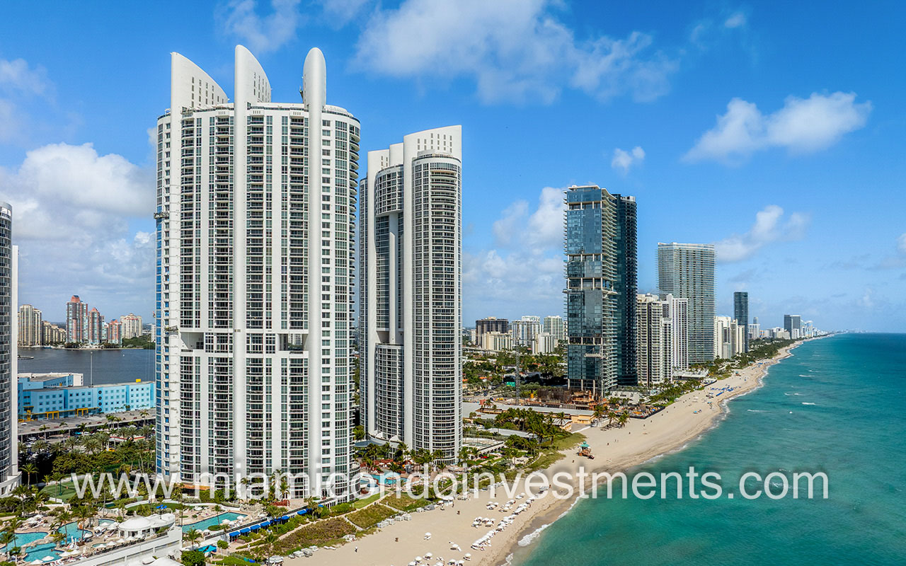Trump Palace drone facing building and North shoreline direction from ocean