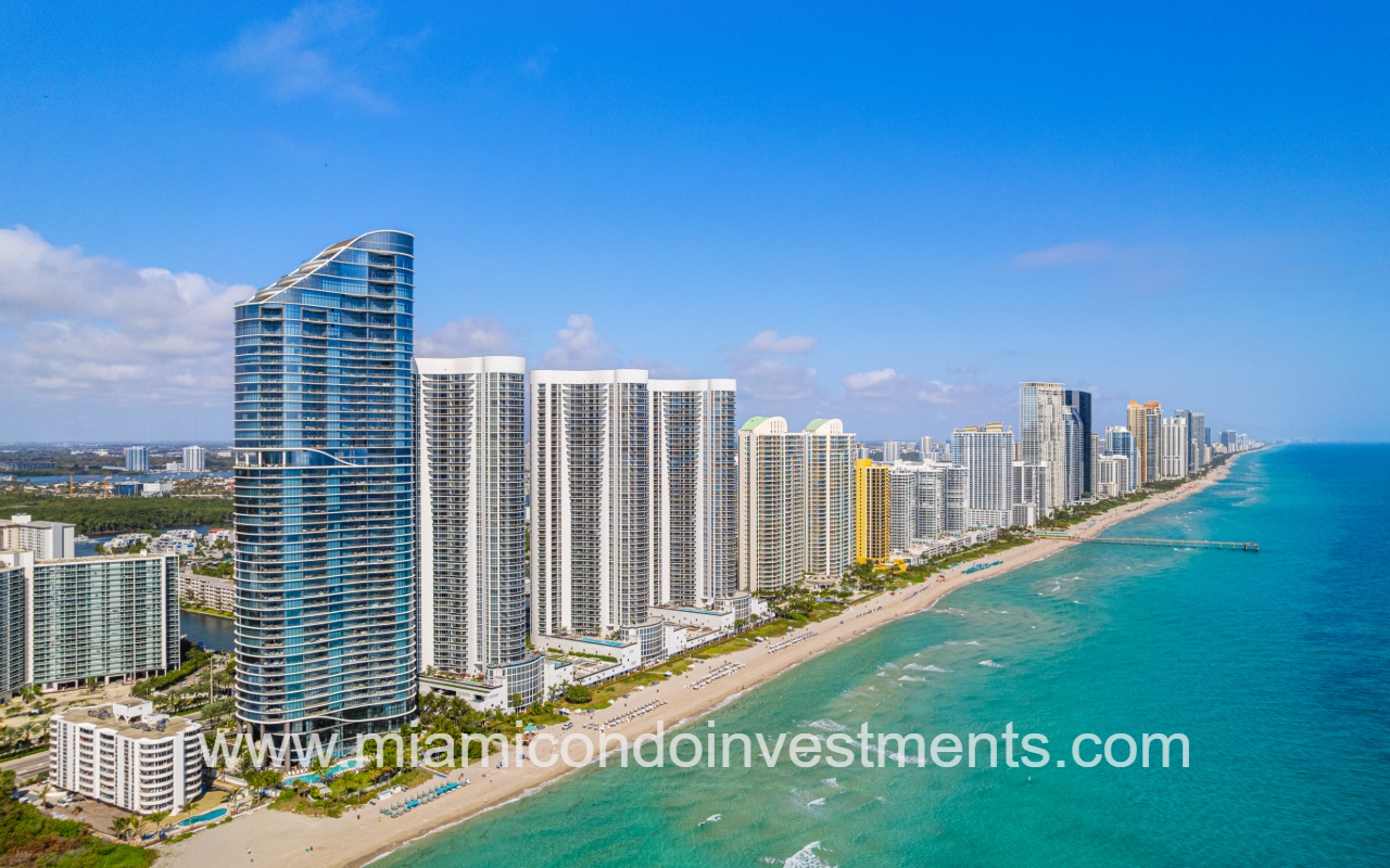 Turnberry Ocean Colony North drone view northward facing of condo buildings skyline on blue ocean