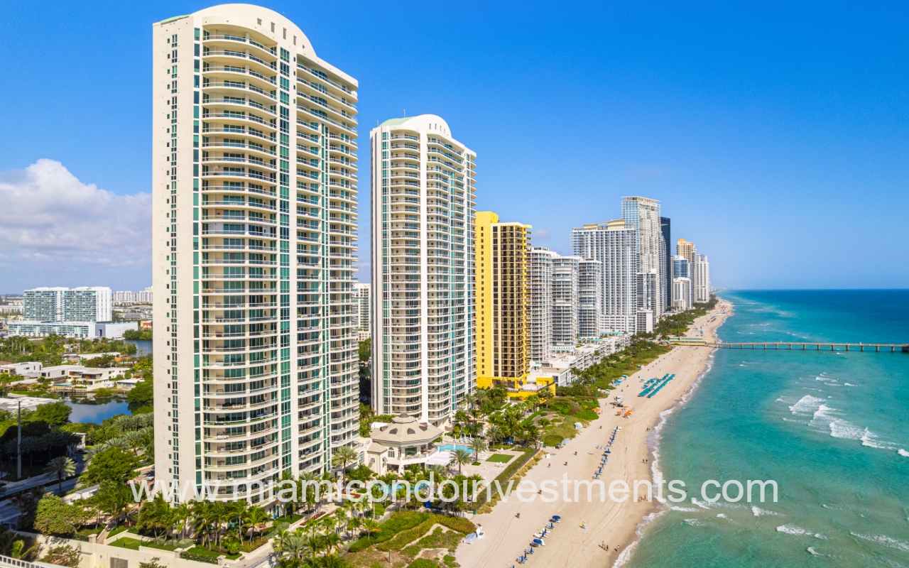 Turnberry Ocean Colony North drone closeup northward facing view of condo buildings and shoreline