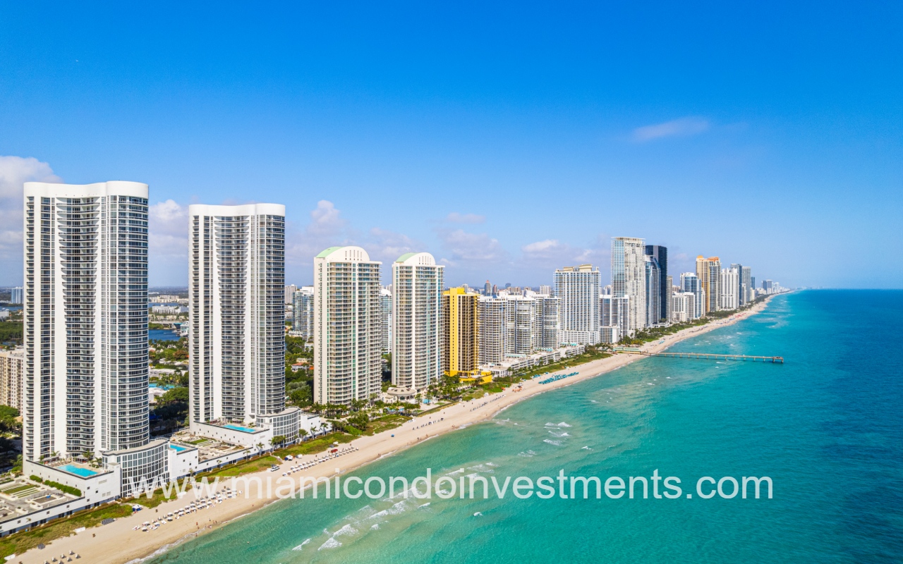 Turnberry Ocean Colony North drone view of condo buildings skyline on blue ocean