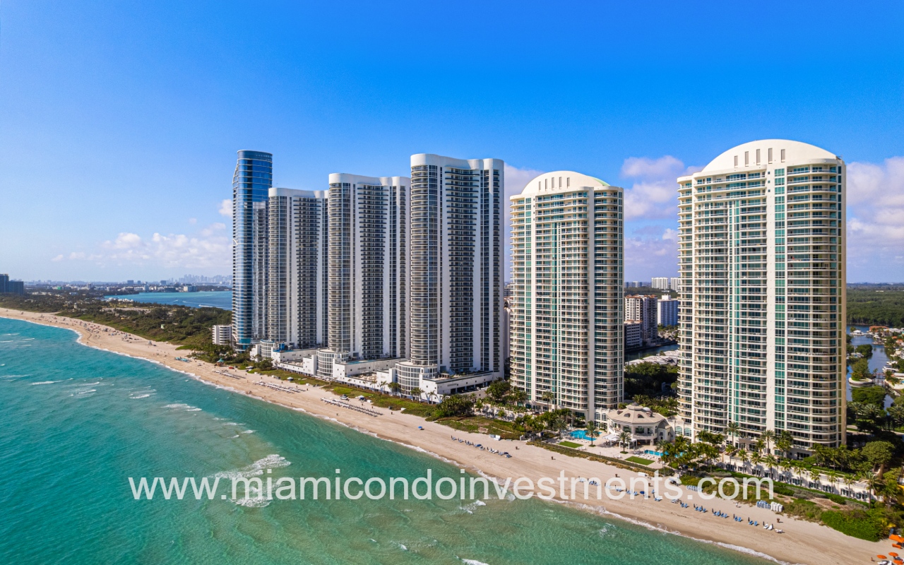 Turnberry Ocean Colony South drone southward facing close angle with condo buildings along beach