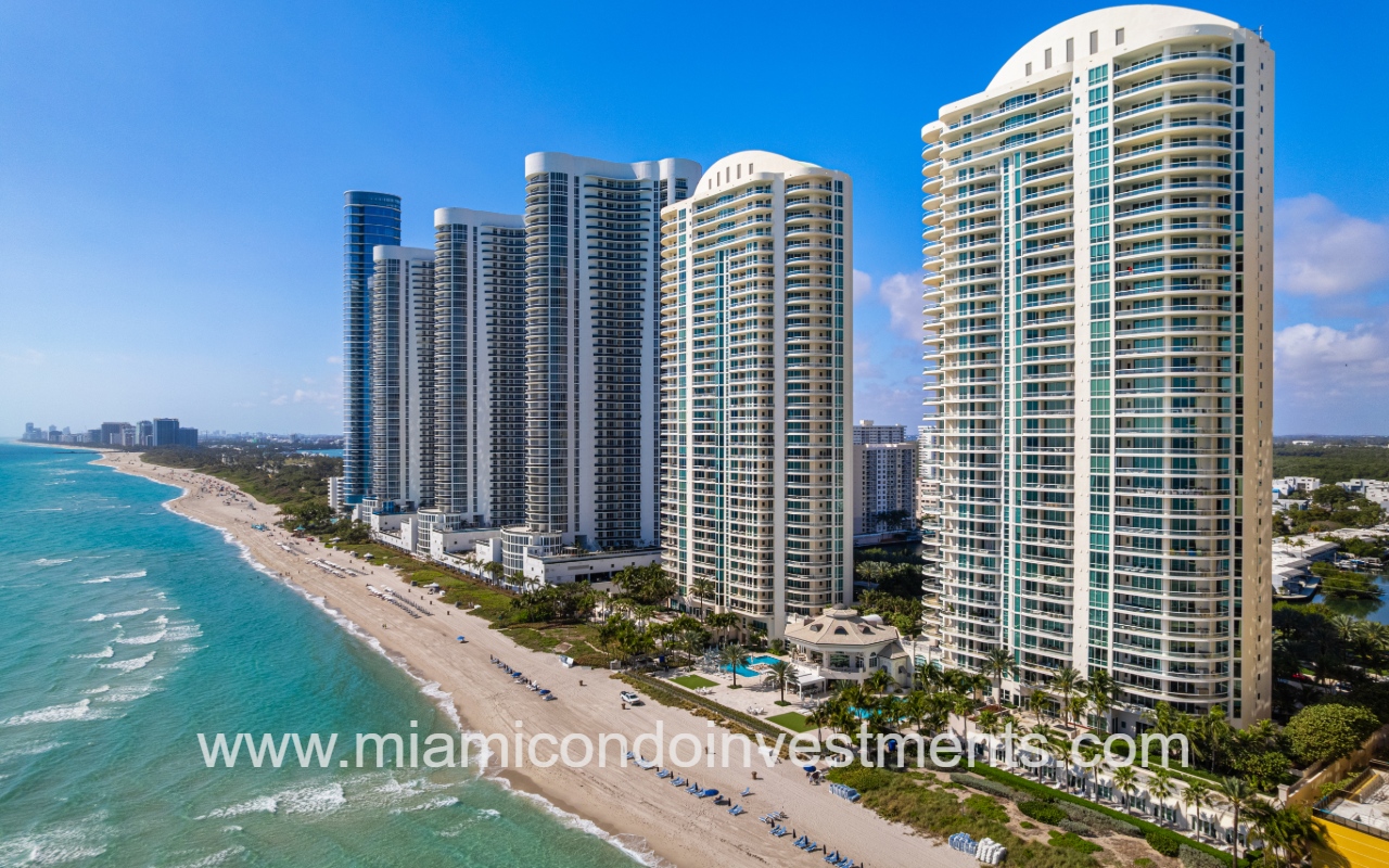 Turnberry Ocean Colony South drone southward facing closeup with condo buildings along beach