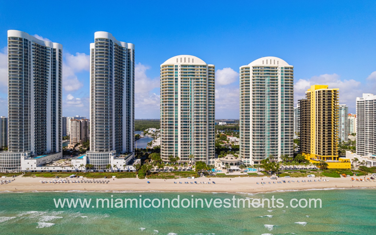 Turnberry Ocean Colony South drone closeup directly facing condo building from over the ocean