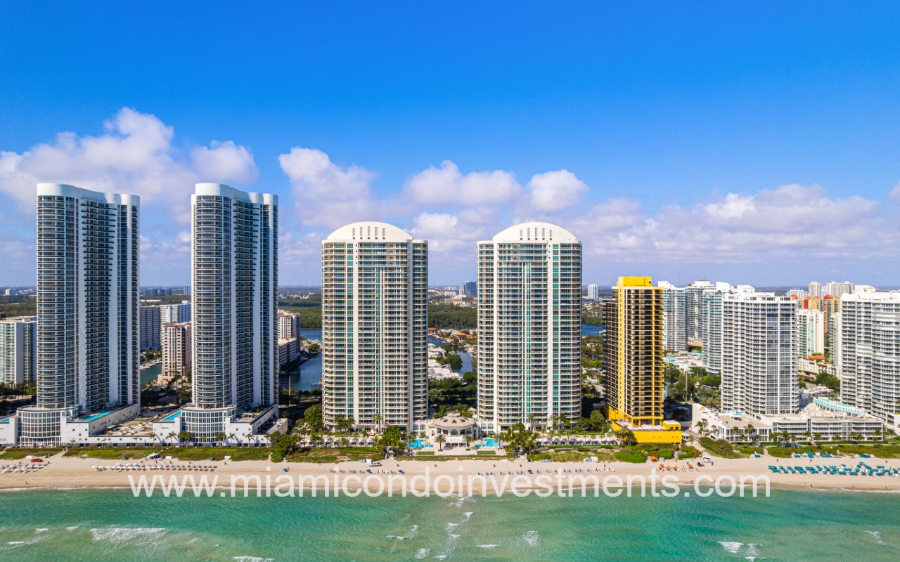 Turnberry Ocean Colony South drone directly facing condo building from over the ocean