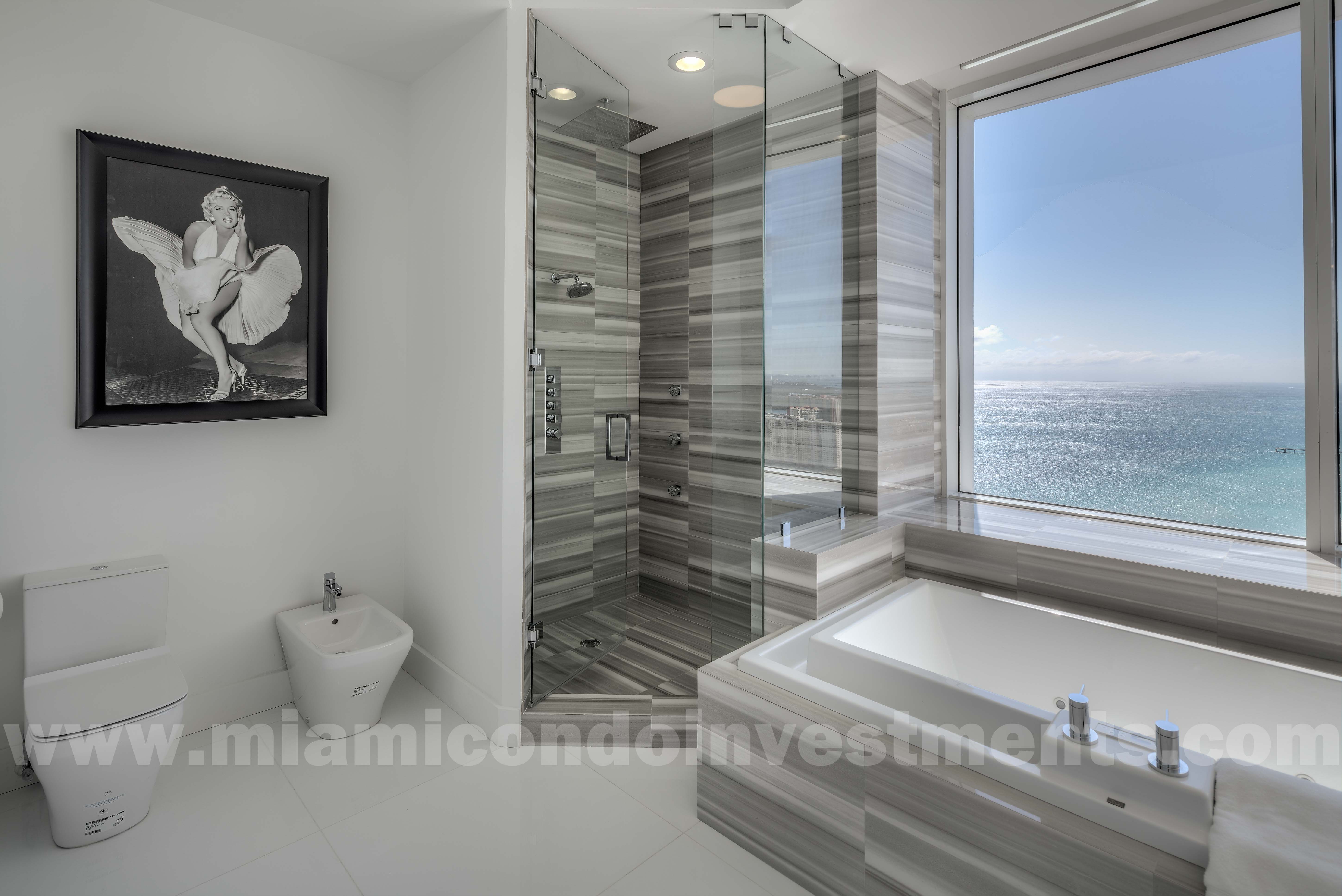 master bathroom with Jacuzzi tub, glass-enclosed shower, bidet, and toilet master bathroom with Jacuzzi tub, glass-enclosed shower, bidet, and toilet