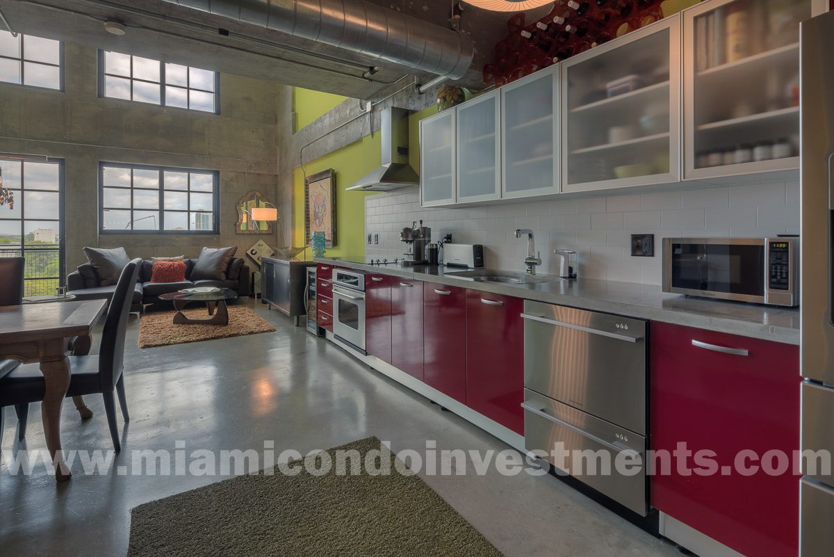 20-foot ceilings. True industrial loft with exposed ceilings and ductwork.