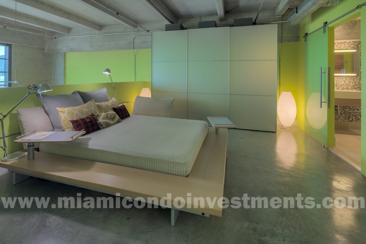 Peter Maly platform bed by Ligne Roset with custom latex foam mattress. Salvarani closet with platinum frosted glass doors.