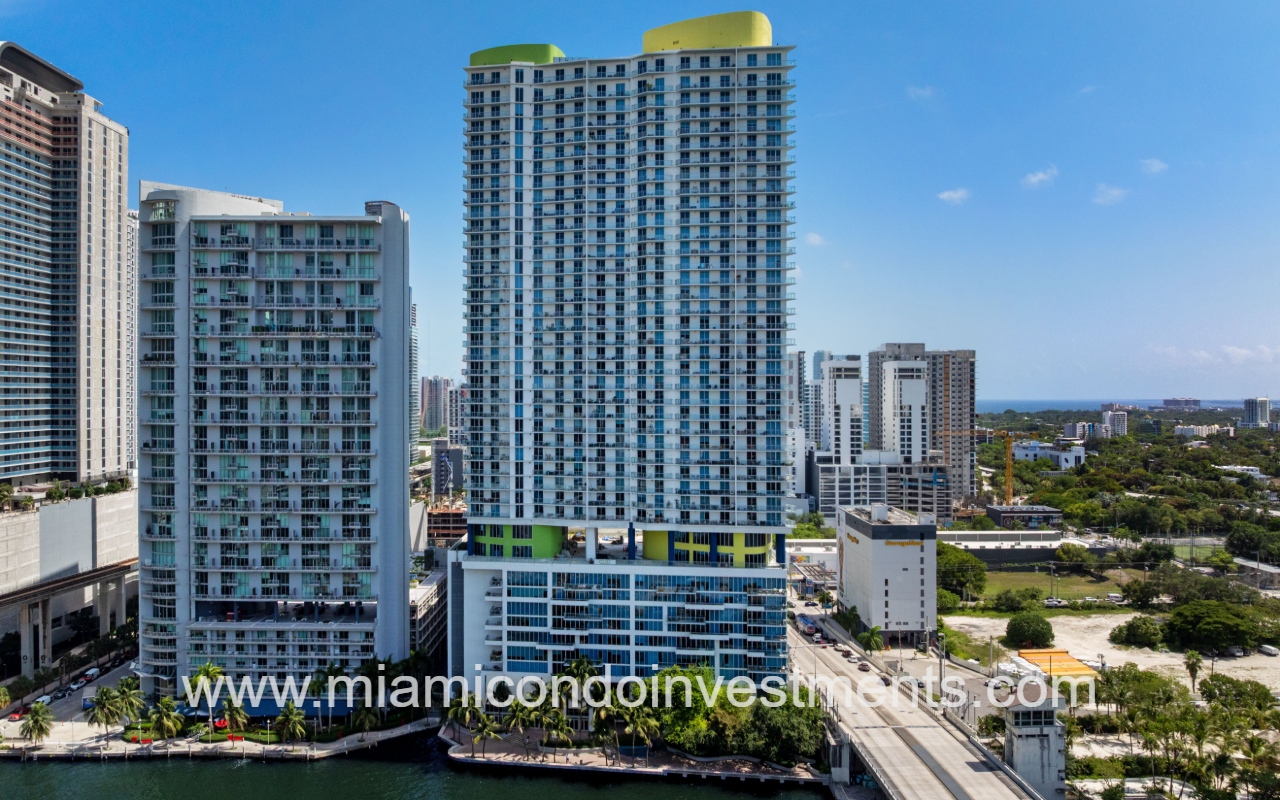 Latitude on the River drone facing condominium building from above river
