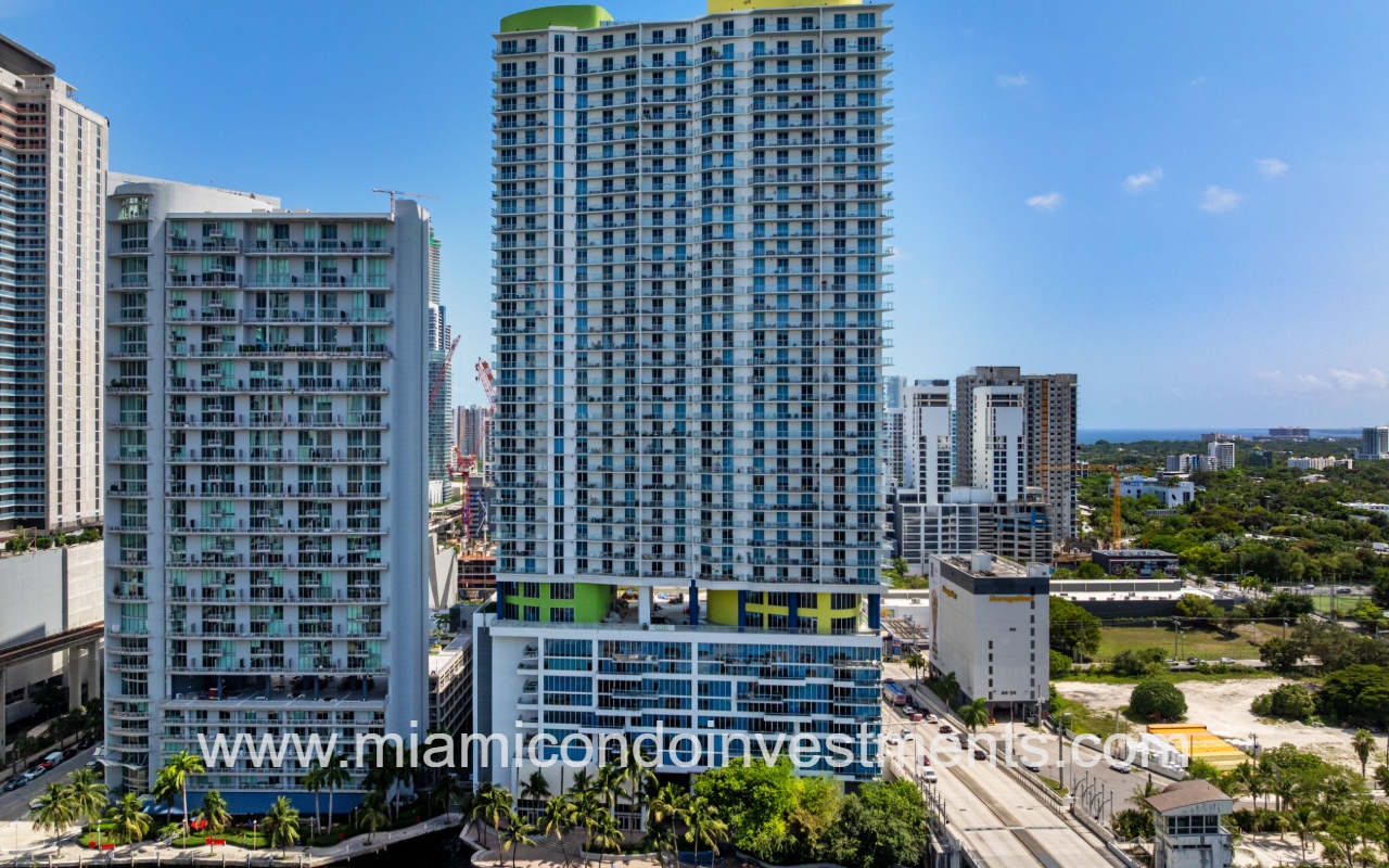 Latitude on the River drone closeup facing condominium building from above river