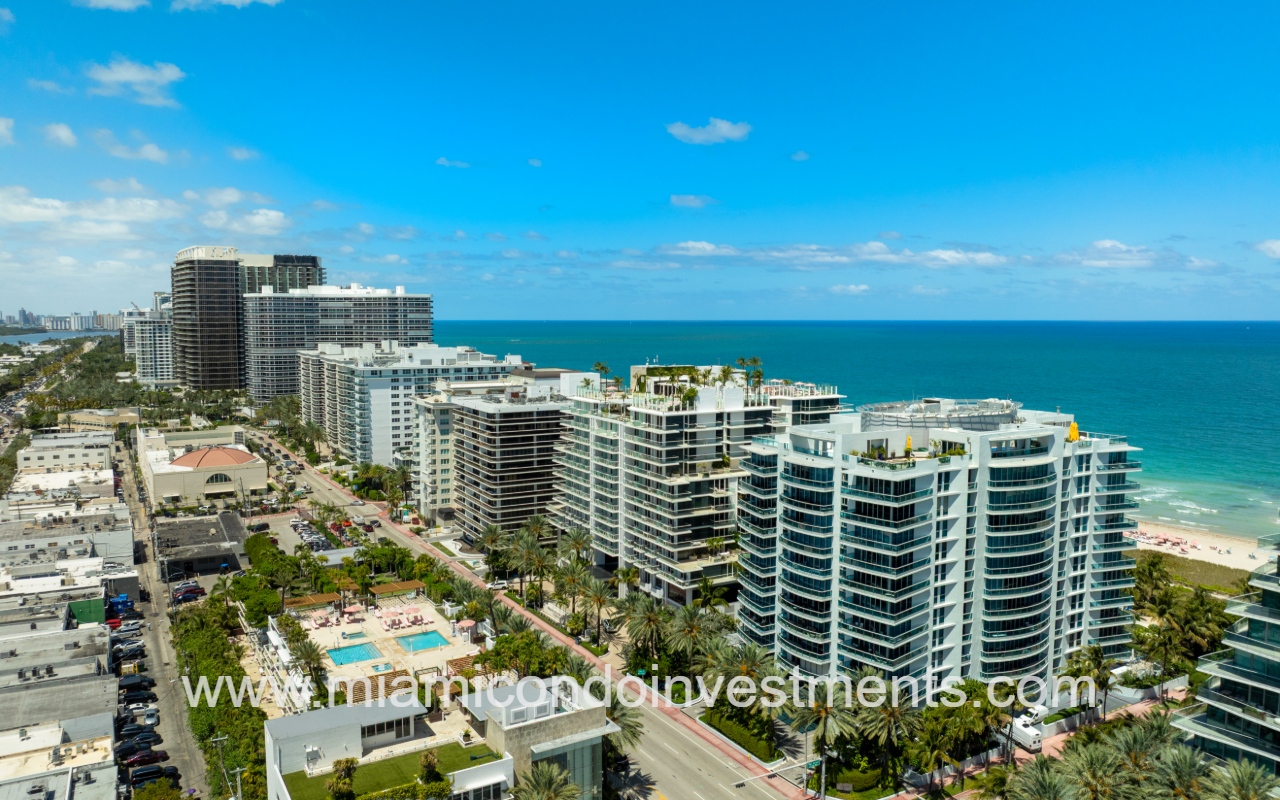 Azure drone view overlooking condo building and buildings along street
