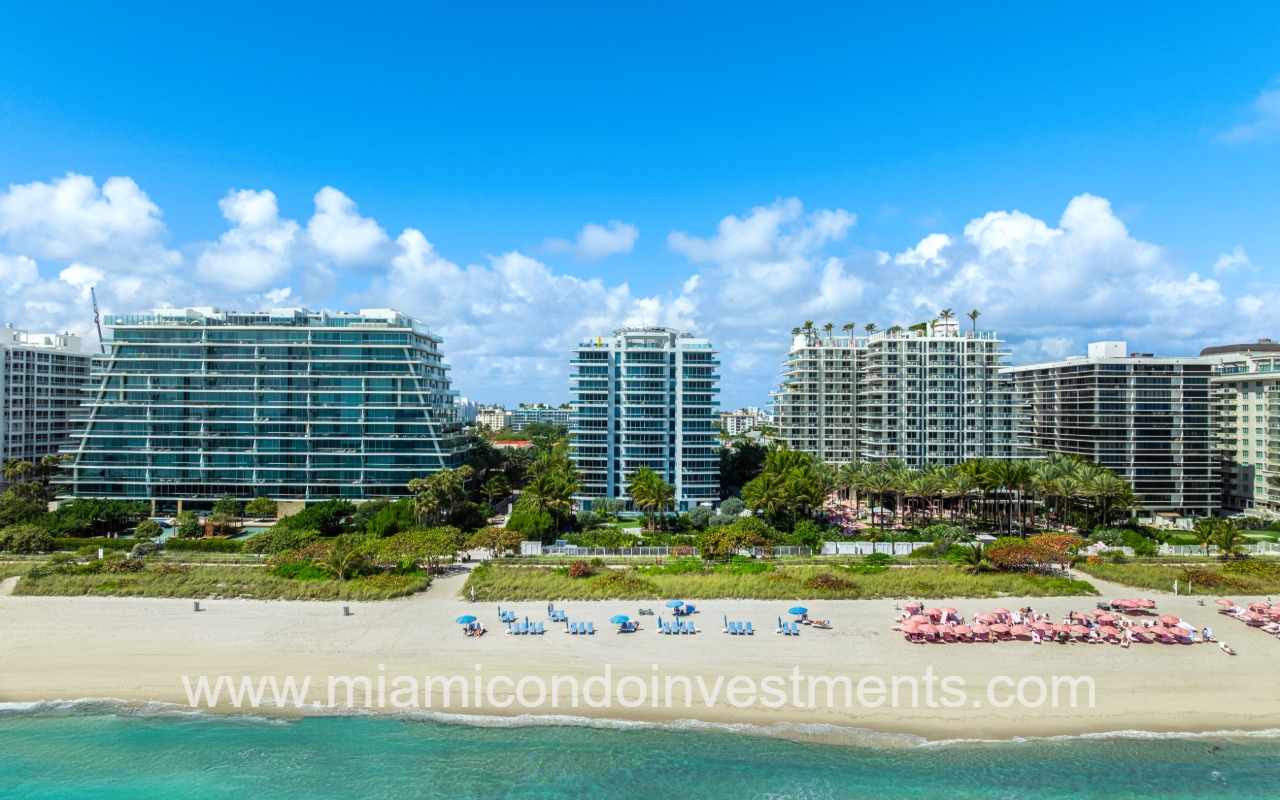 Azure drone profile view of condo building from over the water
