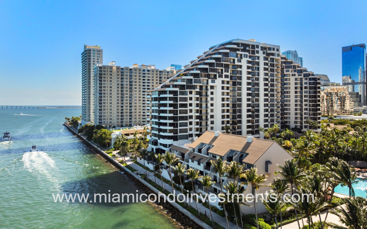 Brickell Key One drone side angle view of building and waterway
