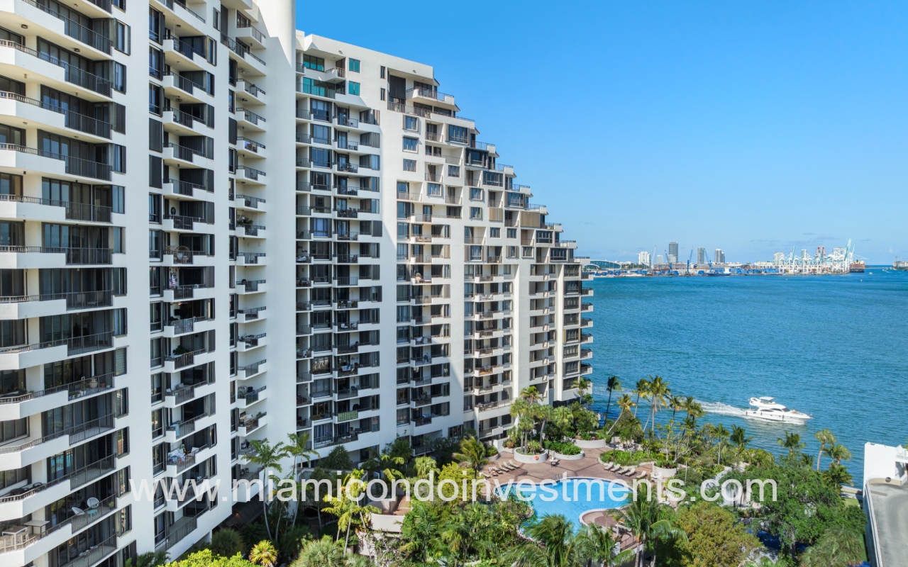 Brickell Key One drone facing side of building with waterfront backdrop