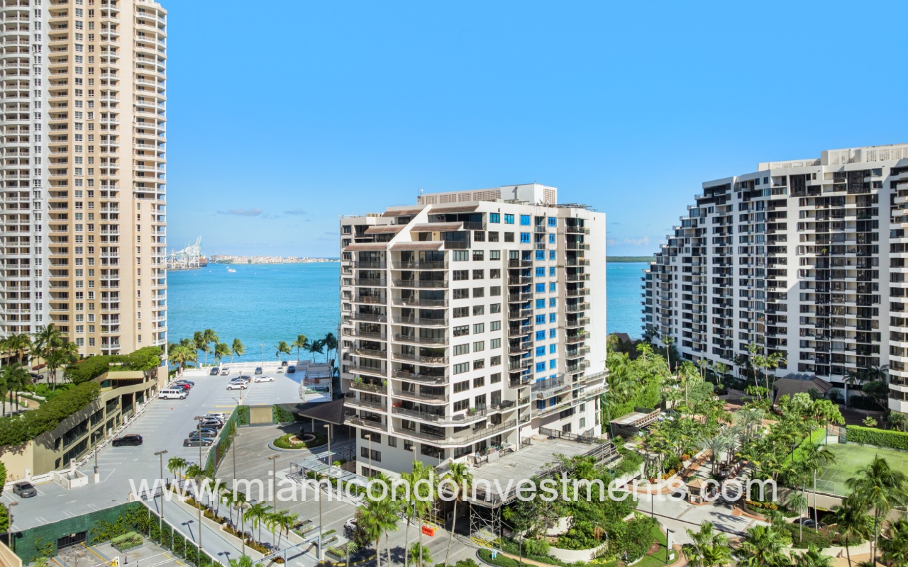 Brickell Key Two drone facing angle of condo building with waterfront backdrop