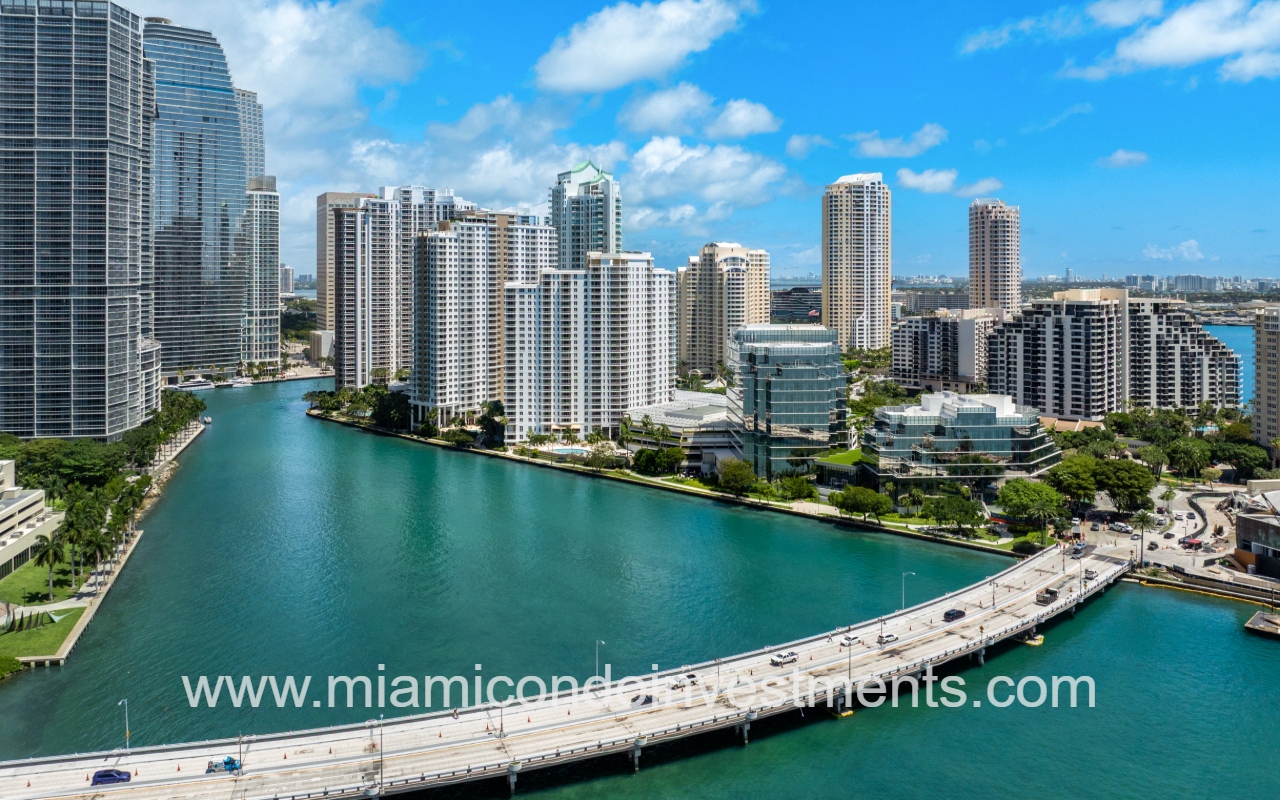 Courvoisier Courts aerial view of building on waterfront near bridge