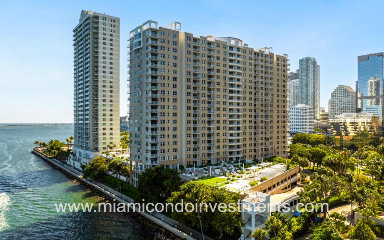 Isola drone view of condo building from waterway