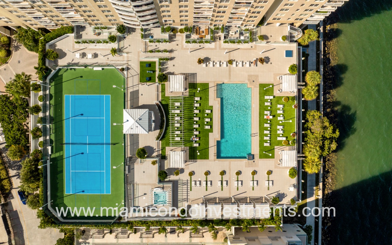 Isola condo building top down view of pool and tennis courts