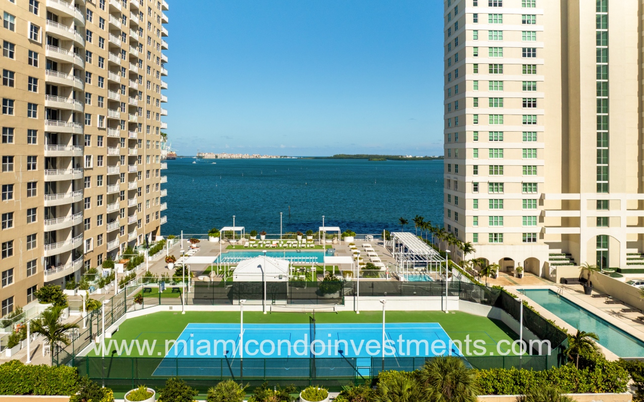 Isola drone view of condo building amenities overlooking Biscayne Bay