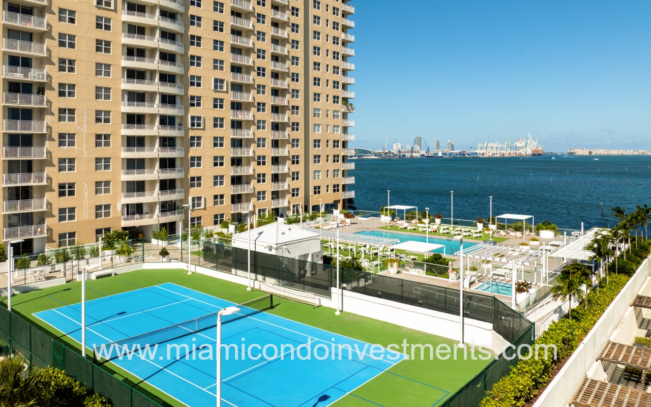 Isola drone closeup view of condo building amenities and Biscayne Bay