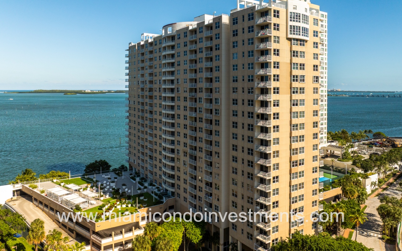 Isola drone closeup view of building and parking overlooking Biscayne Bay