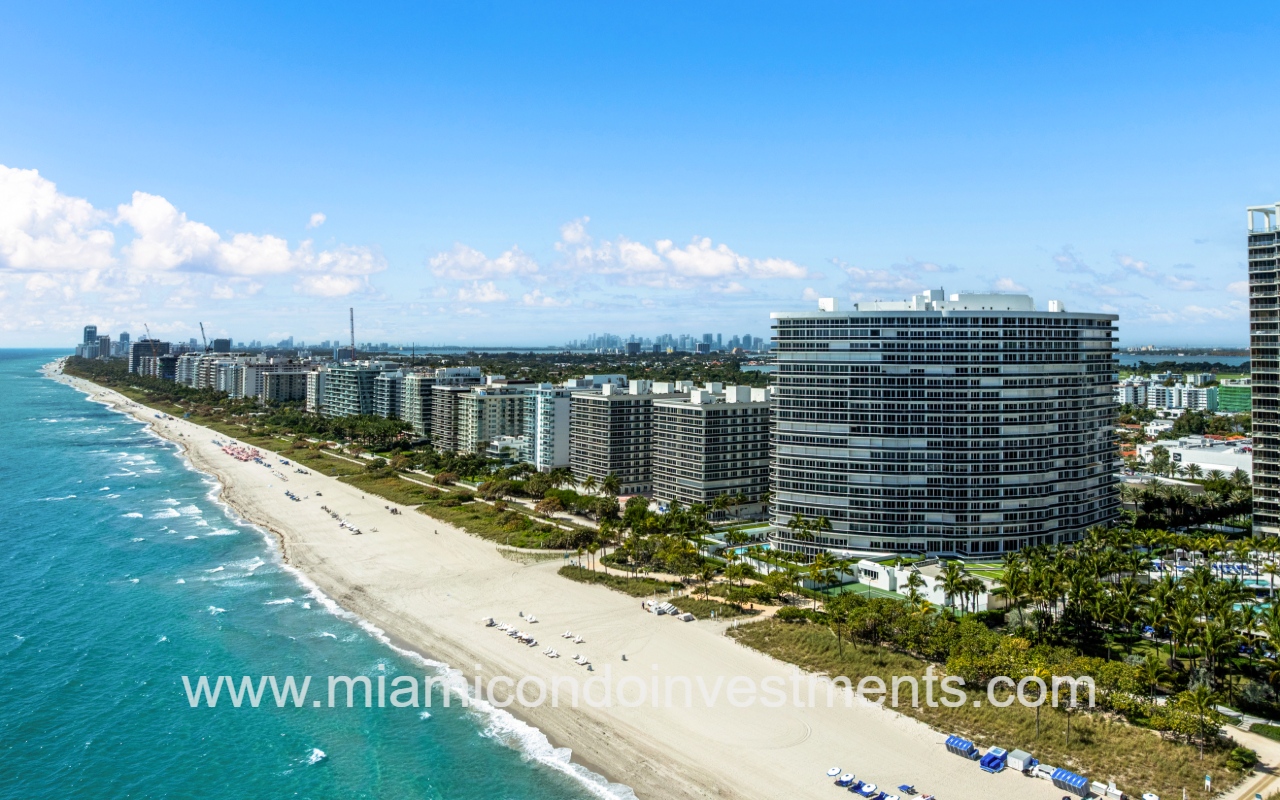 Majestic Tower drone of condo buildings along the ocean shoreline in the morning