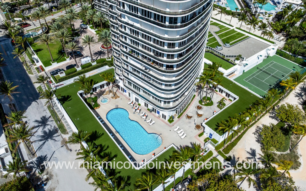 Majestic Tower drone overlooking building profile and pool closeup